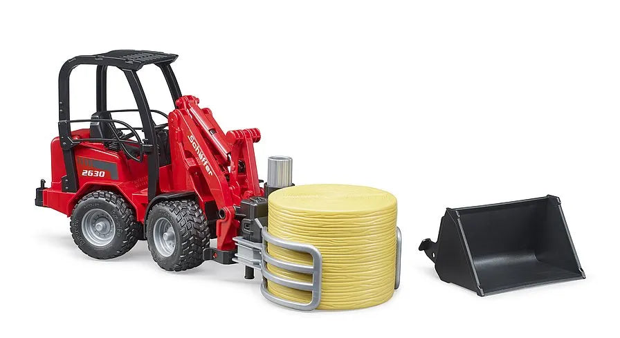 Bruder Schäffer Compact loader with bale gripper + bale