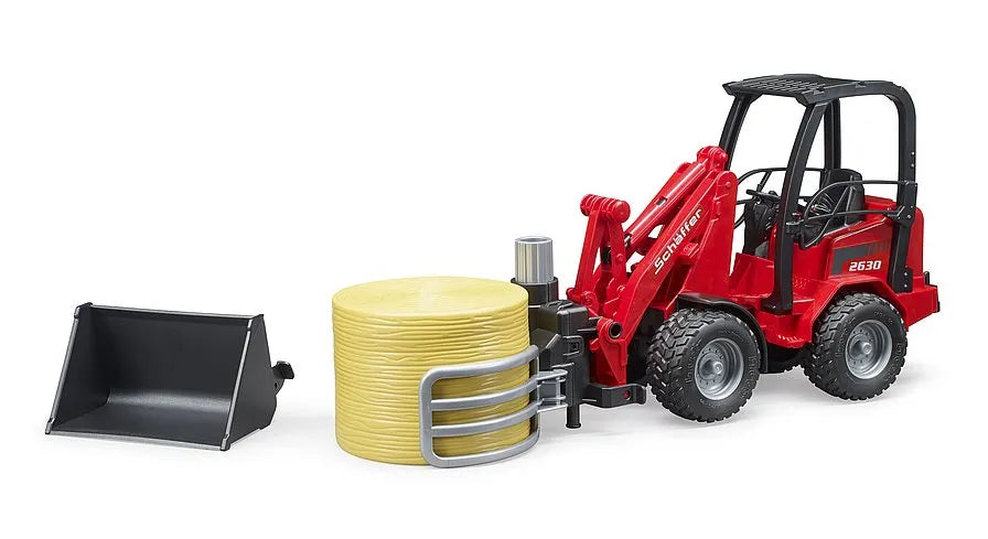 Bruder Schäffer Compact loader with bale gripper + bale
